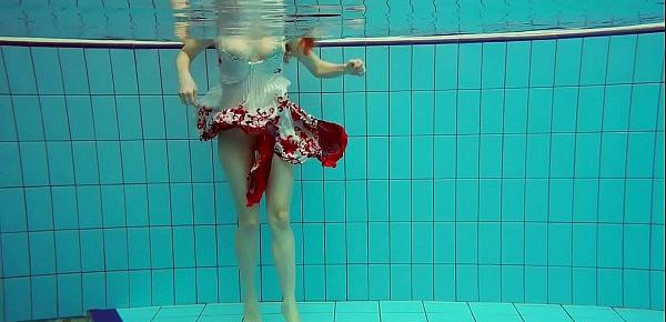  Hot Polish redhead swimming in the pool